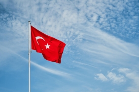 turkish-flag-flutters-flagpole-against-sky-with-clouds-with-copy-space-idea-background-wallpaper
